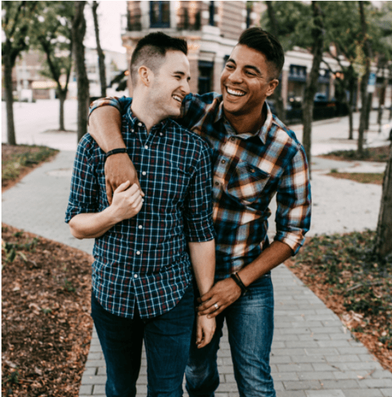 gay fathers through surrogacy smiling